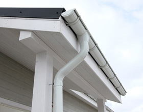 Side view of a roof gutter and pipe