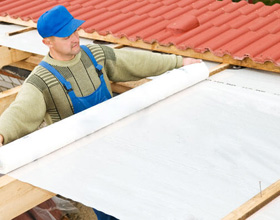 Man repairing exposed roof