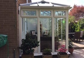 Exterior view of white framed conservatory with long windows