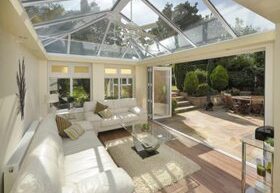 Interior of white framed conservatory with open doors
